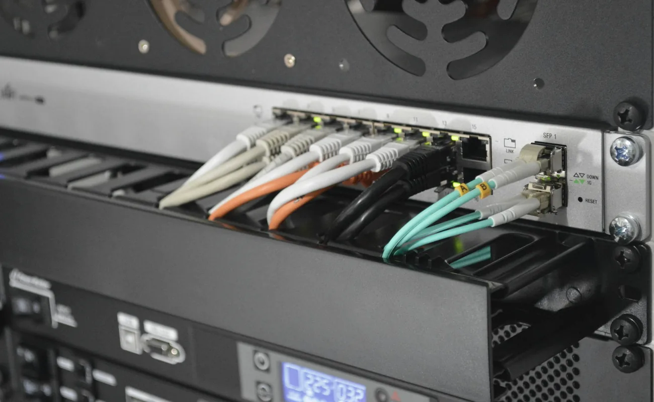 Fibre optic patch panel with green and yellow patch leads