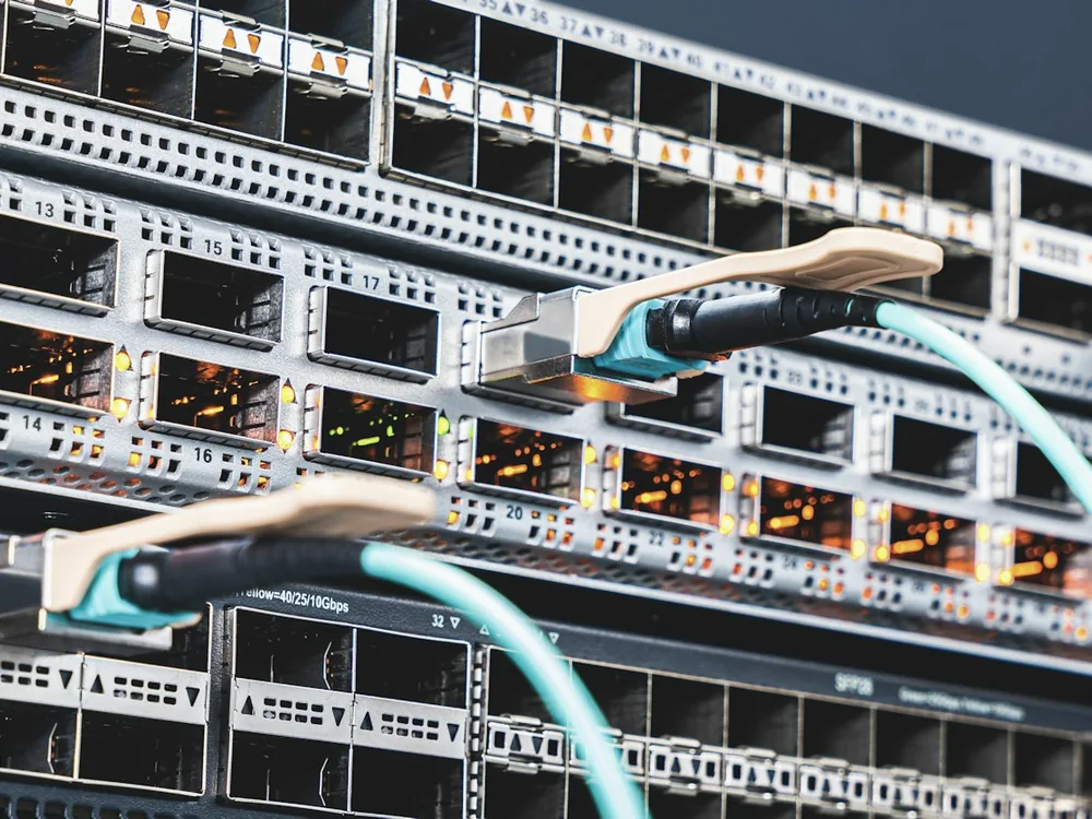 Network switch ports with brightly coloured patch cables plugged in
